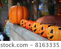 Halloween Jack Lanterns lined up shop front 8163335