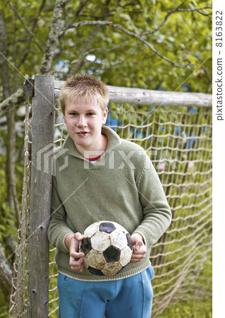 The teenager in collars with a football The teenager in collars with a football 8163822