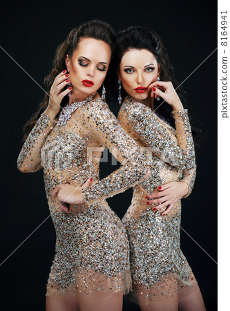 Luxury. Two Sexy Glamorous Women in Shiny Dresses Luxury. Two Sexy Glamorous Women in Shiny Dresses 8164941