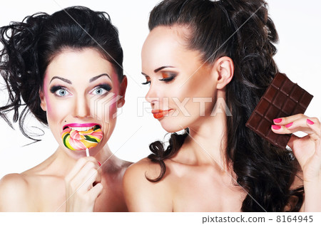 Glam. Couple of Funny Women holding Sweets. Positive Emotions. Vitality 8164945
