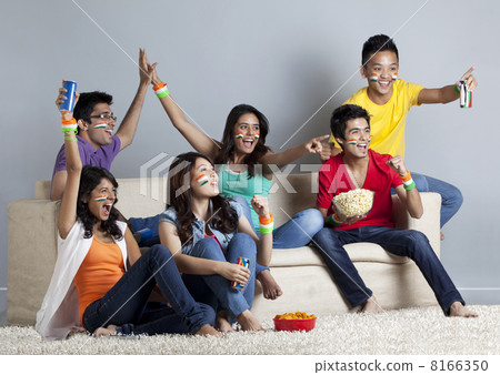 Excited young friends having great time together at home Excited young friends having great time together at home 8166350