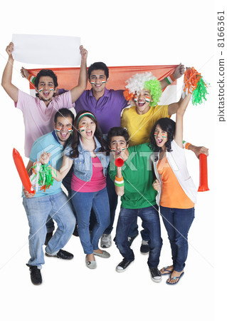 Portrait of enthusiastic young friends cheering with Indian flag over white background 8166361