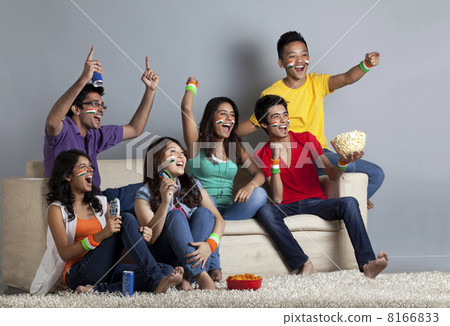 Excited young friends having great fun together at home 8166833