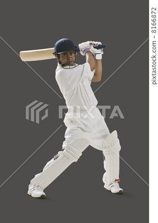 Portrait of young man playing cricket isolated over gray background Portrait of young man playing cricket isolated over gray background 8166872