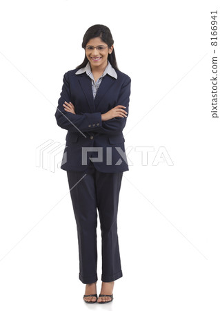 Full length portrait of happy young businesswoman with arms crossed isolated over white background Full length portrait of happy young businesswoman with arms crossed isolated over white background 8166941