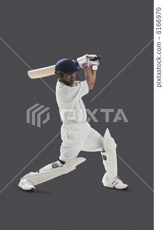 Young man playing cricket isolated over gray background 8166970