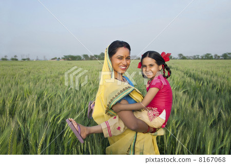 Portrait of a cheerful mother and daughter in the field 8167068