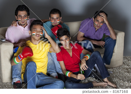 Young male friends reacting with disappointment while watching boxing match 8167168