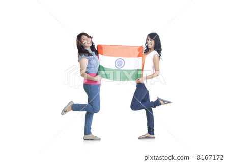 Full length portrait of young women in casuals holding Indian flag over white background Full length portrait of young women in casuals holding Indian flag over white background 8167172