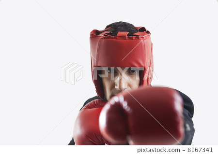 Businessman with boxing gloves punching 8167341