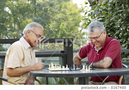 Senior men playing chess in leisure time 8167480