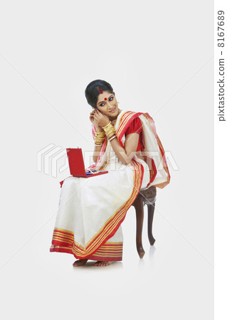 Bengali woman wearing jewelery Bengali woman wearing jewelery 8167689