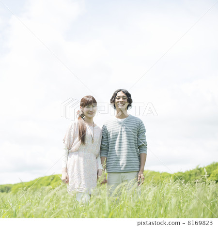 A couple smiling at the meadow 8169823