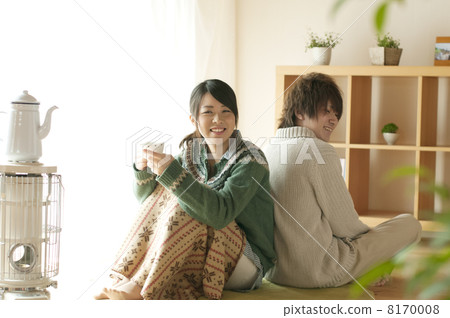 A couple drinking hot drinks A couple drinking hot drinks 8170008