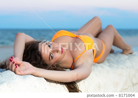Brunette in orange swimsuit 8171004