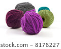 Several balls of wool on a white background 8176227