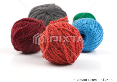 Several balls of wool on a white background 8176228