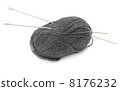 Ball of wool and knitting needles, white background 8176232