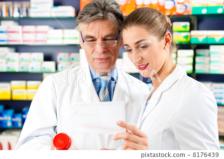 Two pharmacists in pharmacy consulting Two pharmacists in pharmacy consulting 8176439
