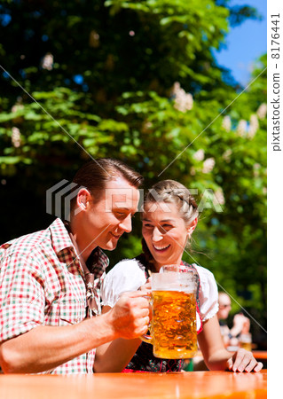 Happy Couple sitting in Beer garden Happy Couple sitting in Beer garden 8176441