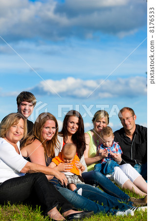 Family and multi-generation - fun on meadow in summer 8176533