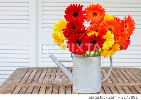 bouquet of gerberas on wooden table 8178891
