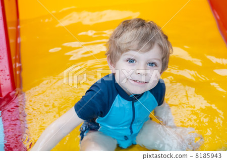 toddler boy swimming, having fun and playing in water toddler boy swimming, having fun and playing in water 8185943