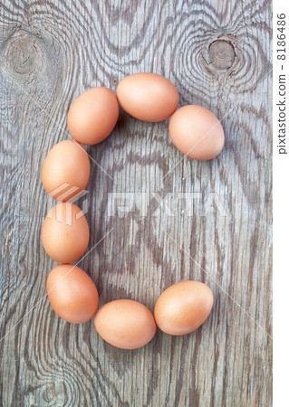 A letter c from the eggs for easter. On a wooden texture. A letter c from the eggs for easter. On a wooden texture. 8186486