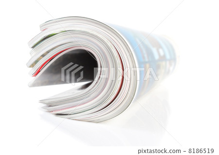 Group of twisted magazine. Close-up on a white background. 8186519