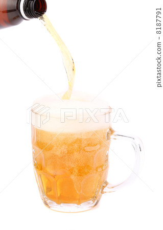 Pouring beer into mug isolated 8187791
