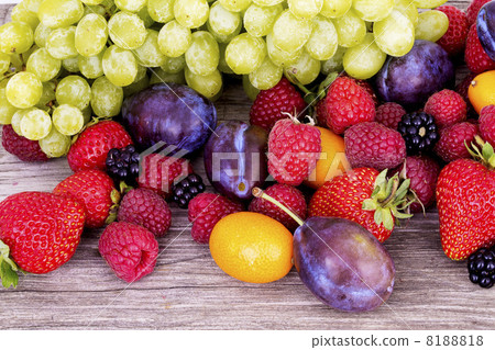 tasty summer fruits on a wooden table tasty summer fruits on a wooden table 8188818