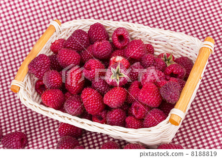fresh redraspberry with leafs in basket fresh redraspberry with leafs in basket 8188819