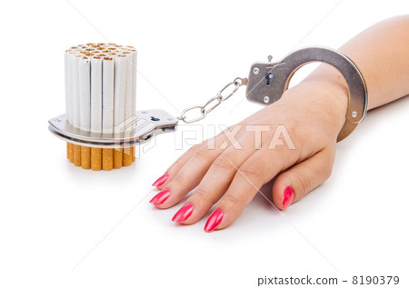 Addition concept with cigarettes and handcuffs 8190379