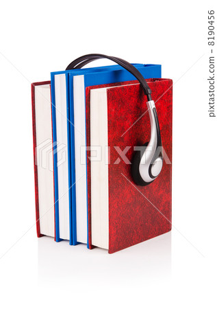 Concept of audio books with earphones on white Concept of audio books with earphones on white 8190456