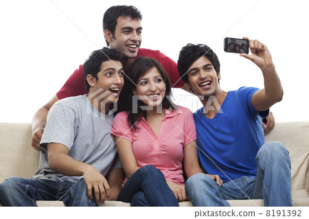 Friends clicking self photograph over white background 8191392