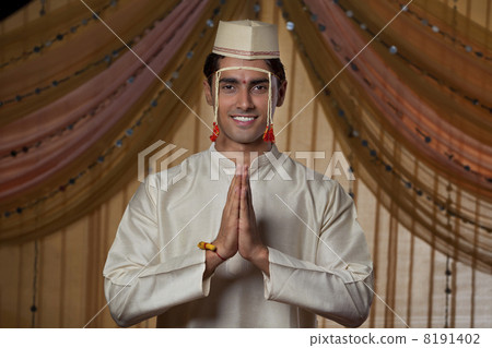 Smiling Maharashtrian groom doing Namaste Smiling Maharashtrian groom doing Namaste 8191402