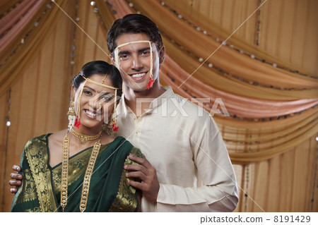 Portrait of happy Maharashtrian couple smiling together on wedding day 8191429