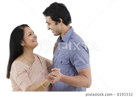 Mother and son looking at each other while dancing 8191532