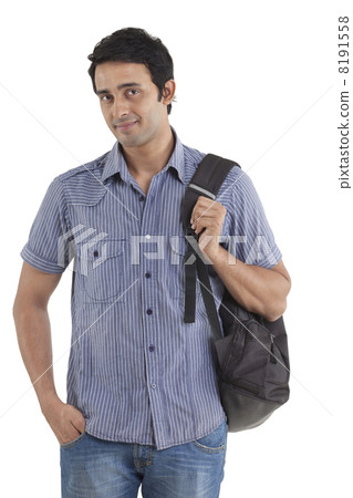 Portrait of smiling young man with hand in pocket Portrait of smiling young man with hand in pocket 8191558