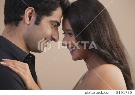 Close-up of romantic young couple looking at each other Close-up of romantic young couple looking at each other 8191780