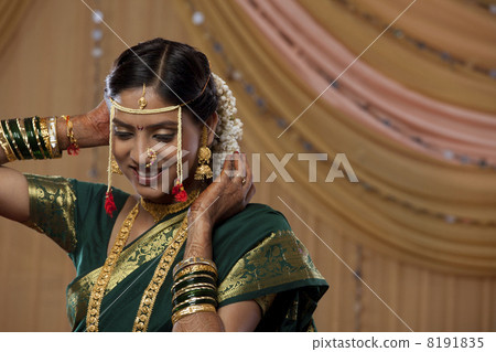 Smiling Maharashtrian bride getting ready for the wedding Smiling Maharashtrian bride getting ready for the wedding 8191835