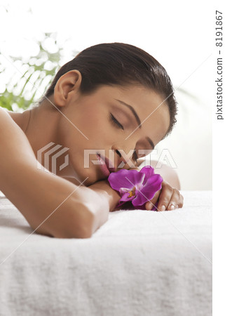 Close-up of young woman lying on message table Close-up of young woman lying on message table 8191867