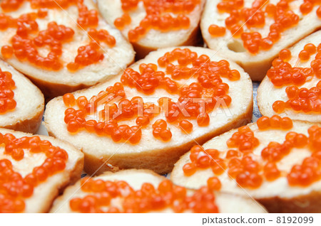 bread and butter with red caviar. Gourmet food 8192099