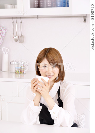 A woman drinking coffee A woman drinking coffee 8198730