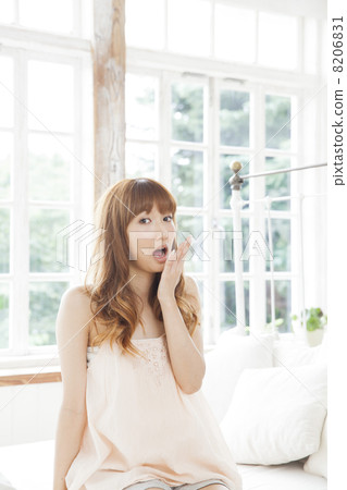 A woman relaxing in the bedroom A woman relaxing in the bedroom 8206831