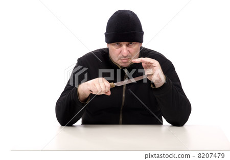 Dangerous man in black clothes with a knife 8207479