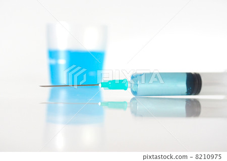 Syringe with blue liquid Syringe with blue liquid 8210975