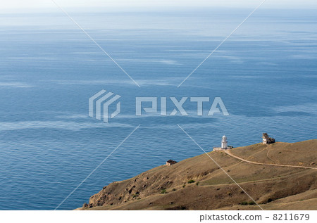 View to sea and lighthouse building 8211679