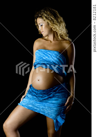 Pregnant woman in blue Pregnant woman in blue 8212181