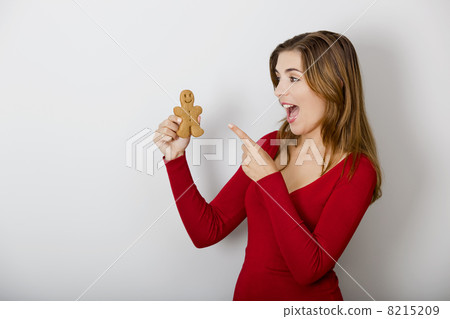 Woman with a Gingerbread cookie Woman with a Gingerbread cookie 8215209